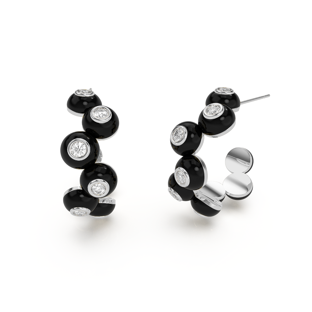 Close-up of Zig-zag Bauble Earrings, featuring a shimmering gold zig-zag design with dangling pearl-like baubles.