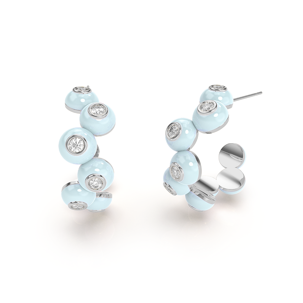 Zig-zag Bauble Earrings: Close-up of two shimmering gold bauble earrings with a zig-zag pattern.