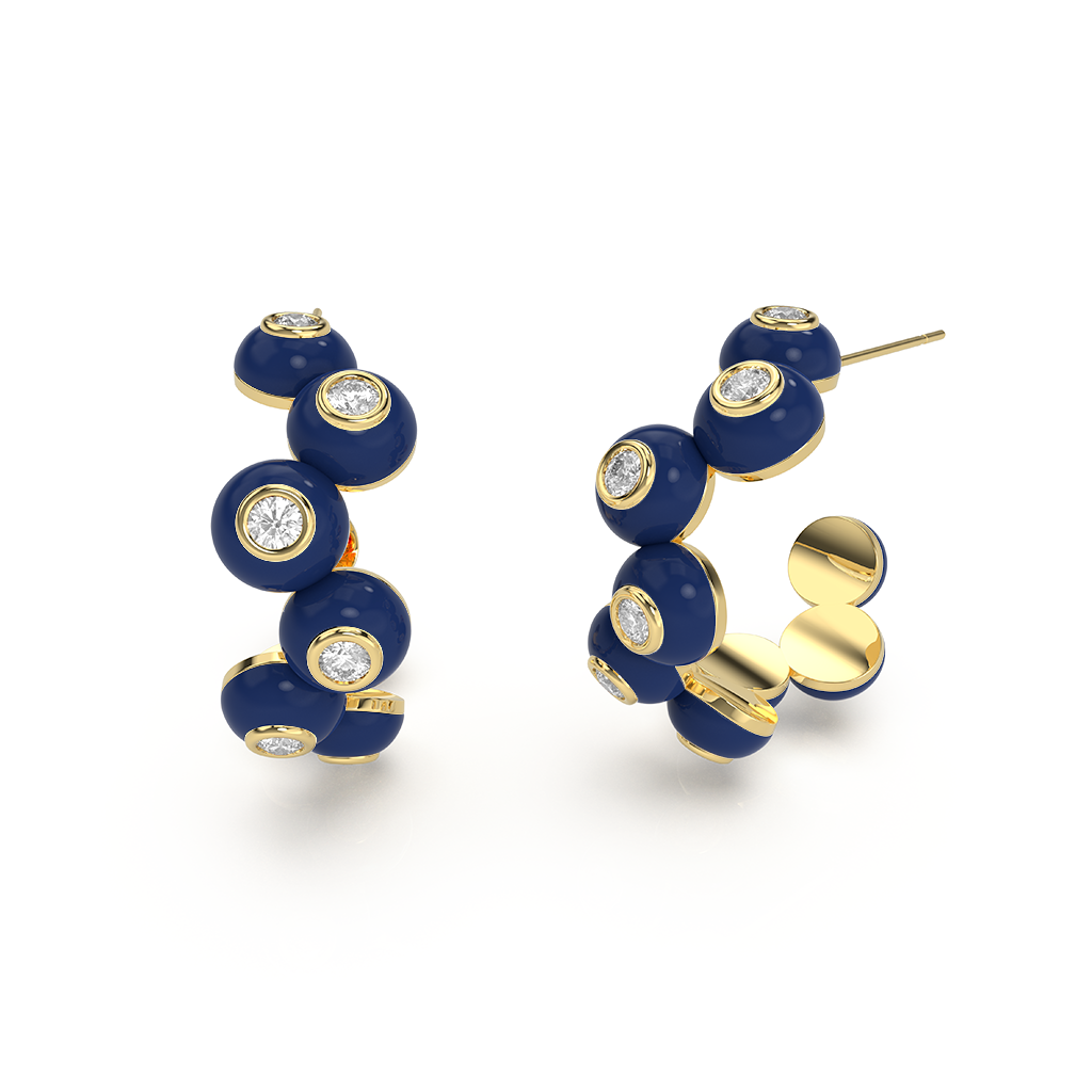 Close-up of Zig-zag Bauble Earrings, featuring gold-toned metal zig-zag shapes suspended from small studs.