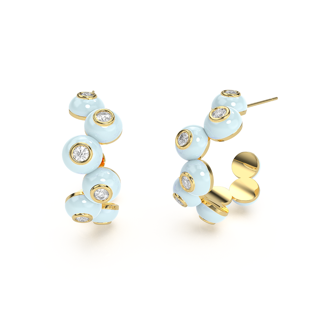 Close-up of silver Zig-zag Bauble Earrings, showcasing their textured, geometric design and metallic sheen.